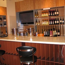 bottles of wine lined up on shelves