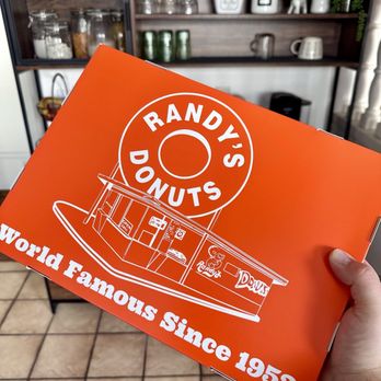 Randy's Donuts - Pink Sprinkles Iced Cake, Cinnamon Roll Chocolate Long John with Cream - Donuts Near Me - Costa Mesa, California Randy's Donuts - Pink Sprinkles Iced Cake, Cinnamon Roll Chocolate Long John with Cream - Donuts Near Me - Costa Mesa, California