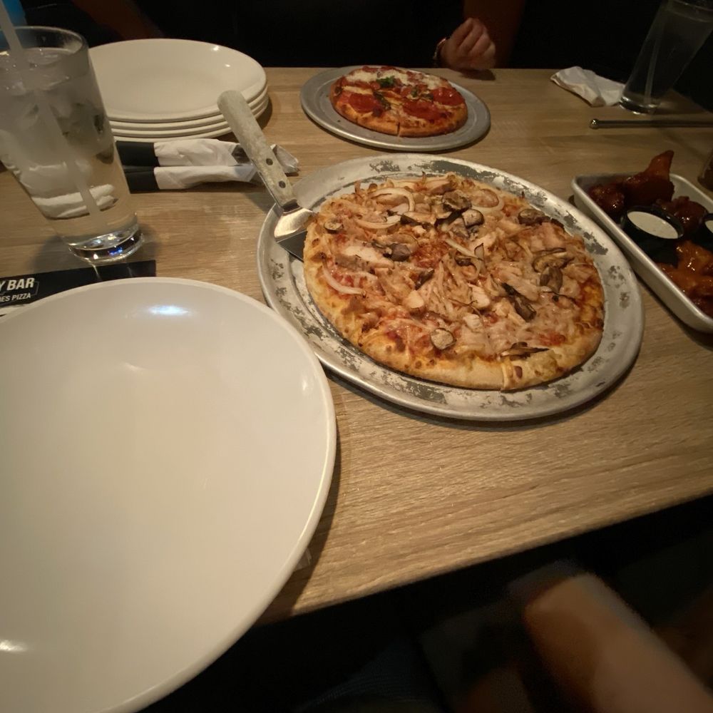Two Cities Pizza - Vegan cheese pizza with chicken yellow onion and mushrooms. - Pizza Near Me - Suwanee, Georgia Two Cities Pizza - Vegan cheese pizza with chicken yellow onion and mushrooms. - Pizza Near Me - Suwanee, Georgia
