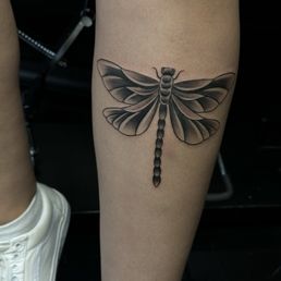 Dragonfly tattoo by Moses Dragonfly tattoo by Moses