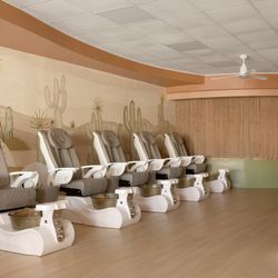 Ergonomically designed spa chairs paired with luxurious soaking bowls for a truly elevated pedicure experience.