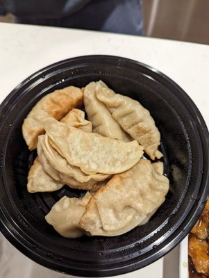 Photo of Hong Kong - Dawsonville, GA, US. a bowl of dumplings and a plate of chinese food