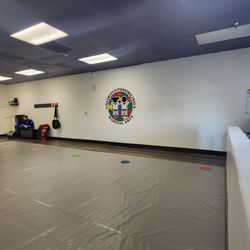 Unlimited Possibilities Martial Arts - Big mat, open concept.