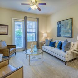 Monterra Las Colinas Apartments - Carpeted living rooms and bedrooms