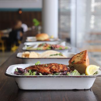Brown Bag Seafood - a long table with food on it - Salad Near Me - Chicago, Illinois Brown Bag Seafood - a long table with food on it - Salad Near Me - Chicago, Illinois
