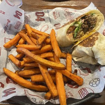 Mugshots Grill & Bar - My Philly Wrap with sweet potato fries. - Bars Near Me - Pace, Florida