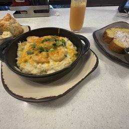 Southern Shrimp & Grits, French Toast & Complimentary Biscuit that came with the Shrimp and Grits and a Strawberry Mimosa.