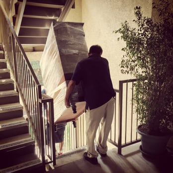 Chargers Moving Company - Lambert and Lamberto moving a "Mule Chest" down some pretty sketchy stairs. - Movers Near Me Chargers Moving Company - Lambert and Lamberto moving a "Mule Chest" down some pretty sketchy stairs. - Movers Near Me