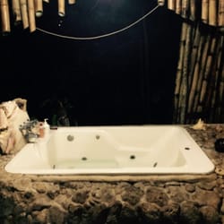 Great Hut Resort - The double jacuzzi tub open bathroom and lounge