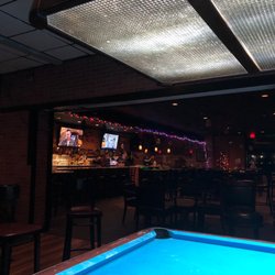 Sharky's Lounge - The bar from the one pool table in Sharky's which is inside Pockets. Lots of pool tables out in the smoke of Pockets.