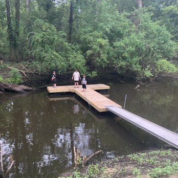 Cajun Heritage RV Park - Boys on the doc looking for gators - Campgrounds Near Me - Breaux Bridge, Louisiana