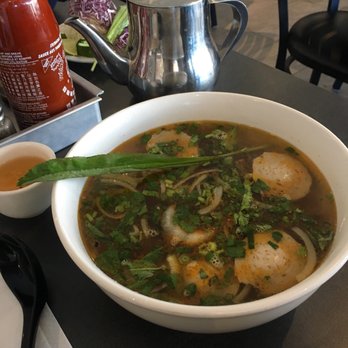Pho Côte-Vertu - a bowl of soup on a table - Vietnamese Near Me - Montreal, Quebec Pho Côte-Vertu - a bowl of soup on a table - Vietnamese Near Me - Montreal, Quebec