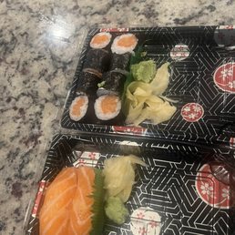 Salmon roll on top, Salmon Sushi on bottom Salmon roll on top, Salmon Sushi on bottom