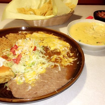 Fiesta Mexicana - Chicken Chimichanga with beef enchilada combo rice and beans. This plate is huuuuuge! - Mexican Near Me - Belgrade, Montana Fiesta Mexicana - Chicken Chimichanga with beef enchilada combo rice and beans. This plate is huuuuuge! - Mexican Near Me - Belgrade, Montana