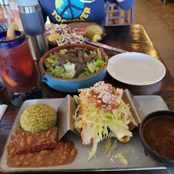 Maggie's Blue Rose - Potato tacos in foreground. Caesar salad in middle. Grilled fish tacos in background. Ordered mole sauce on side, so good! - Mexican Near Me - Avalon, California