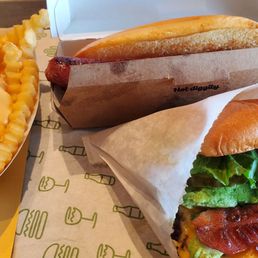 Bacon cheeseburger, cheese fries and hot dog Bacon cheeseburger, cheese fries and hot dog