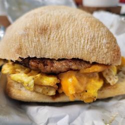 The Great Northern Coffee Bar - Sausage, egg, and cheddar on artisan roll