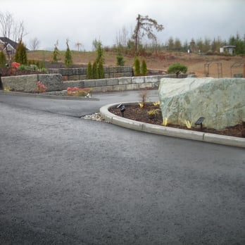 Create-A-Curb - Curbing glued permanently to asphalt.  Contains mulch as well as diverts water runoff. - Landscaping Near Me - Lacey, Washington