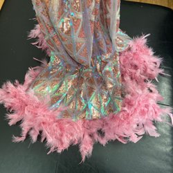 CDK Kreative Kreations - There are areas where the feathers are full and others where it's flattened out. It isn't consistent around the parameter of the dress