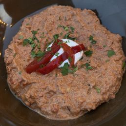 roasted red pepper-walnut dip with fresh yogurt, pickled red peppers, and parsley roasted red pepper-walnut dip with fresh yogurt, pickled red peppers, and parsley