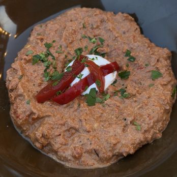 No Ordinary Rabbit - roasted red pepper-walnut dip with fresh yogurt, pickled red peppers, and parsley - Wine Bars Near Me - St. Louis, Missouri No Ordinary Rabbit - roasted red pepper-walnut dip with fresh yogurt, pickled red peppers, and parsley - Wine Bars Near Me - St. Louis, Missouri
