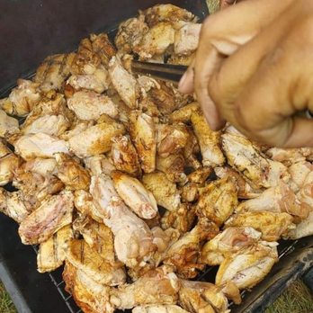 Mr B's BBQ Kitchen - a person cooking chicken - Barbeque Near Me Mr B's BBQ Kitchen - a person cooking chicken - Barbeque Near Me