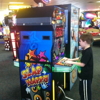 Chuck E. Cheese - a young boy playing a video game - Pizza Near Me - Beaumont, Texas Chuck E. Cheese - a young boy playing a video game - Pizza Near Me - Beaumont, Texas