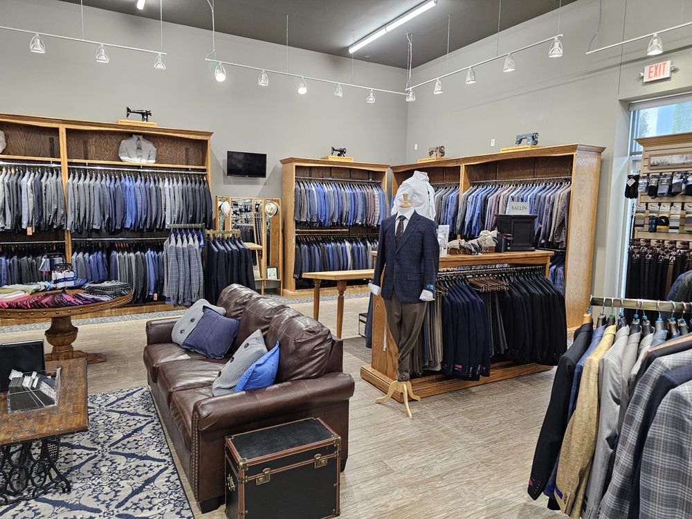 Emsud's Clothiers Logo
