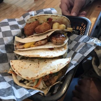 Food Dudes Kitchen - front to back: grilled mahi, pulled pork, blackened shrimp, and coconut shrimp tacos - Seafood Near Me - Kill Devil Hills, North Carolina Food Dudes Kitchen - front to back: grilled mahi, pulled pork, blackened shrimp, and coconut shrimp tacos - Seafood Near Me - Kill Devil Hills, North Carolina