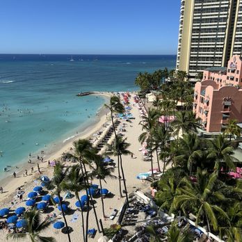Outrigger Waikiki Beach Resort - View from our balcony at 11:30 AM see how the umbrellas are up and people are out - Resorts Near Me - Honolulu, Hawaii