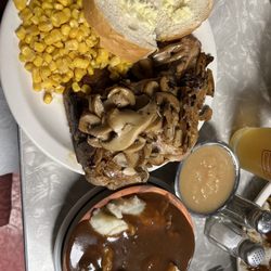 Hotel Exchange - Pork chops with apple sauce, corn, mashed potatoes with gravy and bread.
