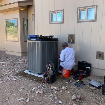 Advantage Home Performance - Maurice hard at work...quiet and efficient, both him and the AC unit! - Heating & Air Conditioning/HVAC Near Me - Prescott, Arizona