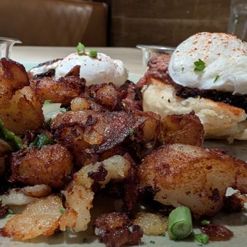 Pappas Delta Blues Smokehouse - Hash Brown Potatoes with Brisket Benedict in the background - Smokehouse Near Me - Webster, Texas Pappas Delta Blues Smokehouse - Hash Brown Potatoes with Brisket Benedict in the background - Smokehouse Near Me - Webster, Texas