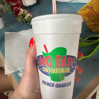 Big Easy Daiquiris - a person holding a cup with a straw - Pizza Near Me - New Orleans, Louisiana Big Easy Daiquiris - a person holding a cup with a straw - Pizza Near Me - New Orleans, Louisiana
