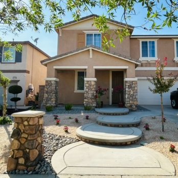 Elite Landscaping - Steps and yard work. Grass removed and river rock and DG put in with plants and tree. - Landscaping Near Me