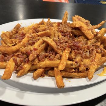 Brewers Landing - Bacon cheese fries- large portion! I think you can order them with cheddar or sleazy cheese. We opted for cheddar - Sports Bars Near Me - Essex, Maryland