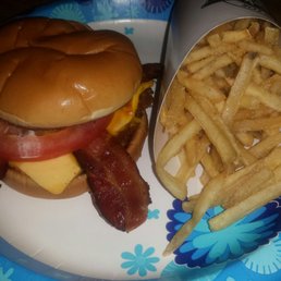 Bacon & cheese steakburger with fries. Bacon & cheese steakburger with fries.