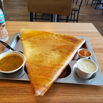 Masala Indian Kitchen - Chicken Chettinad (sp?) Dosa with coconut & tomato chutneys and sambar.  As you can see, this thing is huge! - Indian Near Me - Novi, Michigan
