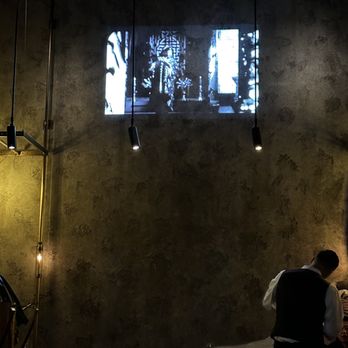 Mott 32 - Asian film projecting on wall - Chinese Near Me - Las Vegas, Nevada