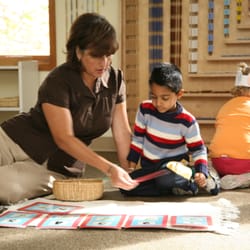 Montessori School At Lone Tree - Miss Martha is giving a lesson.