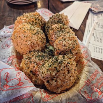 Bob Chinn's Crab House - Bob Chinn's Signature Garlic Rolls // garlic infused olive oil and corn oil, fresh garlic chunks, parsley, and oregano - Seafood Near Me - Wheeling, Illinois Bob Chinn's Crab House - Bob Chinn's Signature Garlic Rolls // garlic infused olive oil and corn oil, fresh garlic chunks, parsley, and oregano - Seafood Near Me - Wheeling, Illinois