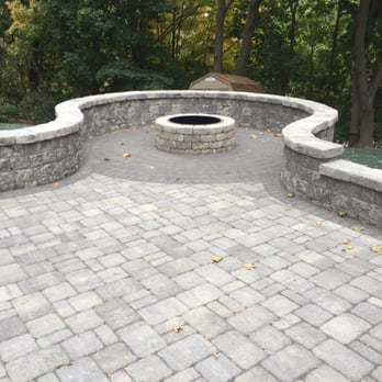 Exteriorscape Services - a brick patio with a fire pit - Landscaping Near Me - Milton, Massachusetts