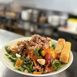 Cotto & Crudo - Fresh & flavourful salad options. Try our arugula and mixed greens salad topped with tuna.