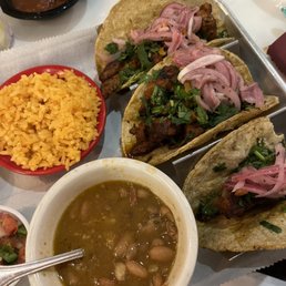 Al pastor tacos with rice and beans
