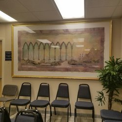 Fishermans Convenient Care - Calm waiting area with nice art and fake plants.