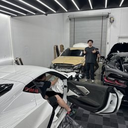 me in front of my c300 being wrapped and my c8 being tinted me in front of my c300 being wrapped and my c8 being tinted