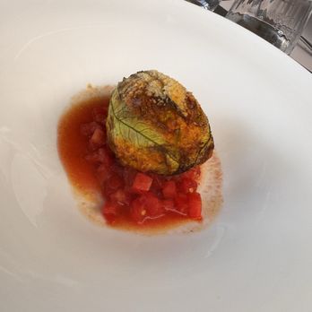 Osteria Veglio - Ovenbaked zucchini flower filled with veil sausage and vegetables. Very different from puglia version of stuffed zucchini flowers... - Italian Near Me - Annunziata, CN