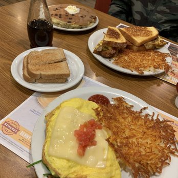 Denny's - Buttermilk pancakes with chocolate chips, grand slam breakfast sandwich, and veggie omelette with hashbrowns and toast - American Near Me - El Monte, California Denny's - Buttermilk pancakes with chocolate chips, grand slam breakfast sandwich, and veggie omelette with hashbrowns and toast - American Near Me - El Monte, California