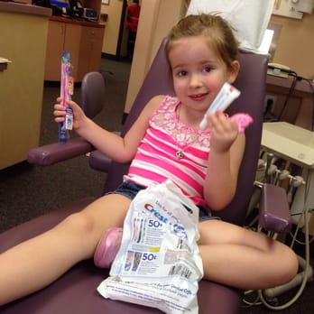 Pediatric Dental Specialists - My girl so happy with her goody bag! Lip gloss- toothbrush and a necklace! - Pediatric Dentists Near Me - Gilbert, Arizona