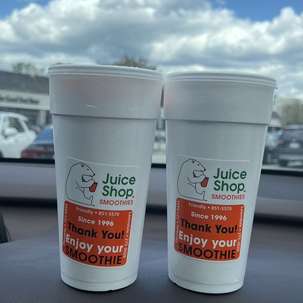 Smoothie drinking in the car. Strawberry Splash and Polar Peach Smoothie drinking in the car. Strawberry Splash and Polar Peach